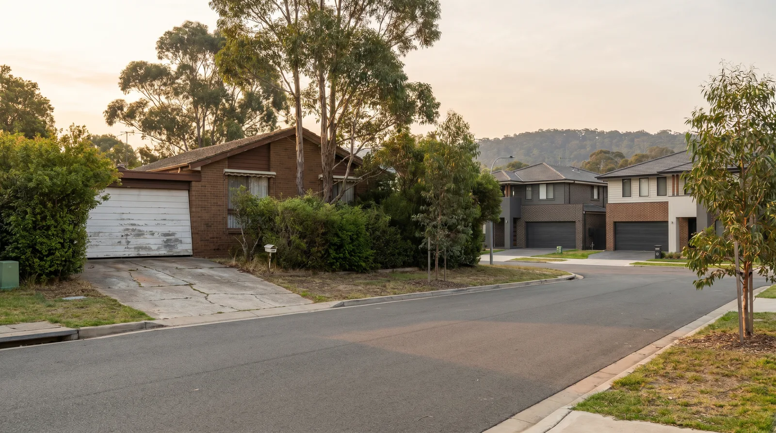 An established brick home in Edgeworth with an older tilt-style garage door